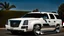 Placeholder: A sleek white shiny (((Customized gangsters lowrider cadillac escalade))), its contours and details perfectly captured in a (((cinematic view))), zipping along a winding road under a beautiful blue black morning sky