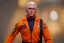 Placeholder: Mike pence G.i. Joe toy doll space force uniform inside a blister package hanging on A rack in toystore, fluorescent orange, wide angle shot whole body, black moonboots, Green, space helmet, head to toe