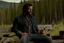 Placeholder: Still frame of Jared Keeso as Marvel's Wolverine in a new movie. He is wearing jeans, and a flannel shirt and smoking a cigar.