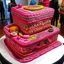 Placeholder: A giant pink cake filled with musical instruments designed in Kuna Molas