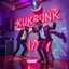 Placeholder: MR Kukrunk is Benny and DJ Roy in a disco, dancing, "Kukrunk" on sign wall, disco light, strobe, disco ball