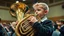 Placeholder: Young schoolboy playing a tuba, a brass musical instrument, award-winning colour photograph, orchestra, school hall, beautiful lighting