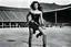 Placeholder: [photo by helmut newton in the arena] Her complexion, after years spent training under the sun, bore the mark of a warrior who had weathered countless battles. Though her face spoke of hardship, there was also an air of grace and serenity that emanated from her every pore. Selene's physique was a testament to her dedication and discipline. Her muscular frame hinted at her physical prowess, yet her movements were fluid, as if she danced with the wind itself. Every sinew and muscle fiber was hone