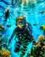 Placeholder: Make a image of a young boy wearing scuba gear, underwater with fish, jellyfish and bubbles. Low angle view looking up towards the surface of the Ocean, Photorealistic.