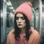 Placeholder: Beatrice dalle, sad,in the metro in the style of a polaroid,, pink,orange, with a knitted hat, eyes closed