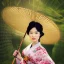 Placeholder: portrait of gorgeous, stunning asian woman with bamboo umbrella, cherry blossoms, kimono, realistic, photo illustrative, ornate, 8K resolution, high-quality, fine-detail, digital art, detailed matte, brian froud, howard lyon, selina french, anna dittmann, annie stokes, lisa parker, greg rutowski, alphonse mucha