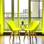 Placeholder: two yellow chairs on a table next to a window,