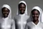 Placeholder: 4 suore africane con tunica grigia figura intera sorrisi, visi armoniosi