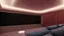 Placeholder: Generate an image of a sleek home cinema with our top-notch projectors and surround sound systems with a star-lined ceiling similar to a Rolls Royce in a high-rise penthouse