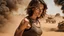 Placeholder: beautiful slender caucasian female technician with a small knife, black tank top, well toned muscles, weathered face, scratched sand camo metal details, short brunette wavy bob haircut, dystopian, desert scene with smoke and explosions, opponent is a giant muscular soldier