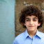 Placeholder: beautiful 12 year old arabic boy with curly hair and light blue eyes