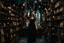 Placeholder: full-height shot of a woman in a tight black dress, holding up small glowing symbols, inside a magic book shop