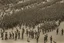 Placeholder: military parade; two columns of soldiers; birds eye view; soldiers marching