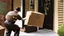 Placeholder: UPS shoves package up gentlemans back door