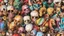 Placeholder: a picture of a dark, comedic, anatomically correct wall of colorful tightly packed skulls of varying sizes and expressions, photo realistic, insanely meticulous, highly detailed, part of a collection of bones on display, 64k, dystopian, vray