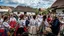 Placeholder: hungarian village wedding, group of women dancing in authentic Hungarian sárköz colorful folk dress with flowers shapes , high realistic, high qulity, detailed, happy, stunning, perfect photo