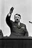 Placeholder: adolf hitler hält eine ansprache in 1945 und hebt die rechte hand mit dem gruß