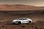 Placeholder: A Tesla 'Model S' is drifting at high speeds, at the Cydonia region on Mars. (CINEMATIC, WIDE ANGLE LENS, PHOTO REAL)