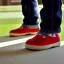 Placeholder: A picture of a little man with a head as round as a bowling ball wearing big plateau shoes