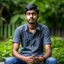 Placeholder: an 24 year old indian man, oval face, light skin, wearing shirt and jeans, sitting in a garden, peaceful, front face portrait, short hair, slightly muscular built, handsome