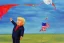 Placeholder: Painting, donald trump flying a Traditional kite in a rainstorm