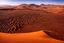 Placeholder: a grand chocolate mountain very melting in the sahara, hot, suny day