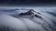 Placeholder: looking down from space at only one single sharp misty mountain cliff coming through the mist and surrounded by the mist at night starry sky