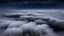 Placeholder: looking down from space at the mist and clouds and storm, surrounded by the mist at night starry sky. majority of the image is space