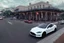 Placeholder: A Tesla 'Model S' is racing at top speed, on the streets of New Orleans. (CINEMATIC, WIDE ANGLE LENS, PHOTO REAL)