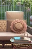 Placeholder: Night, twilight, a light brown wicker sofa with floral cushions, a glass-topped table in front of it, coffee steaming in a porcelain cup, and a down-turned open book next to it. Above the settee, flower bushes in planters, all on the terrace of a luxury house S<AI Nikon D850 highly detailed digital painting sharp focus elegant intricate photorealistic 4k very attractive beautiful dynamic lighting award winning fantastic view crisp quality Unreal Engine very cute cinematic postprocessing acrylic