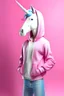 Placeholder: une représentation d'une licorne debout à l'aspect humain avec un pantalon jeans et une capuche rose. le fond de l'image est blanche et la licorne doit etre très féminine