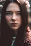 Placeholder: An incredibliy detailed close up macro shot of a 20 years old female model, long dark hair, an artistic portrait, detailed skin, detailed hair, facing to the camera, looking at the camera, cherry blossom falling in the shot, dreamy mood, film photography, realistic, low aperture, bright image, cute, artwork