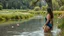Placeholder: a beautiful lady in nice swim suit in river in country side next to river and big tree,wild flowers standing