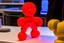 Placeholder: gingerbread man being 3d printed