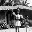 Placeholder: (1960’s stop-motion animation style of las reinas del combate en el suelo in Mexico) She is tied to a stake, her hands above her head, in the governor's villa