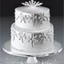 Placeholder: A picture of a simple white cake with silver decoration