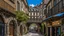 Placeholder: cobbled street with buildings and shops cut from rock, over hanging cliff face, arches, and bridges