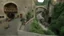 Placeholder: cobbled street with buildings and shops cut from rock, over hanging cliff face, arches, and bridges