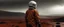 Placeholder: an asian man wearing safety suit with hardhat standing in lighting and storm of rainy weather condition in the field of mars