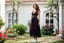 Placeholder: very beautiful lady with beautiful midi dark black-red lace skirt and lace top with curvy hair sports shoes standing in a nice villa yard with trees flowers ,16 by 9