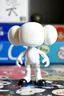 Placeholder: a standing animated figure (head molded into shoulders, no neck, a completely flat face area, stubby legs, bulky arms, no painted details, white in color) vinyl art toy