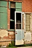 Placeholder: side of an old brick building, with windows, a doorway at the bottom, and worn out painted sign across the top