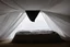 Placeholder: a silhouette in a bed, under the sheet, seen from the ceiling