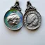 Placeholder: pendant in a form of two conjoined silver coins, watercolor, large strokes, artwork, fantasy