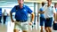 Placeholder: very focused image of upset man wearing shorts and polo shirt told to leave airport lounge by officer