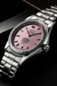 Placeholder: Visualize the renowned Oyster Perpetual case of a pink Rolex watch, sealing in its precision like a vault. Its timeless design is a hallmark of Rolex, a tradition of excellence that stands the test of time."