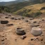 Placeholder: Very early dates for Bell Beakers were found in Castelo Velho de Freixo de Numão in Guarda, central Portugal. The site was located on the summit of a spur. A short-lived first occupation of pre-Bell Beaker building phase at c. 3000 BC revealed the remains of a tower, some pavings, and structures for burning. After a break of one or two centuries, Bell Beaker pottery was introduced in a second building phase that lasted to the Early Bronze Age, c. 1800 BC. A third building phase followed directly