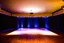 Placeholder: luxury large hall with a stage with flash at center for dance