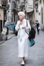 Placeholder: a woman white hair luxury stlye in a street