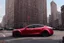 Placeholder: A Tesla 'Model S' is parked, near the Flatiron Building in Manhattan. (CINEMATIC, WIDE ANGLE LENS, PHOTO REAL)